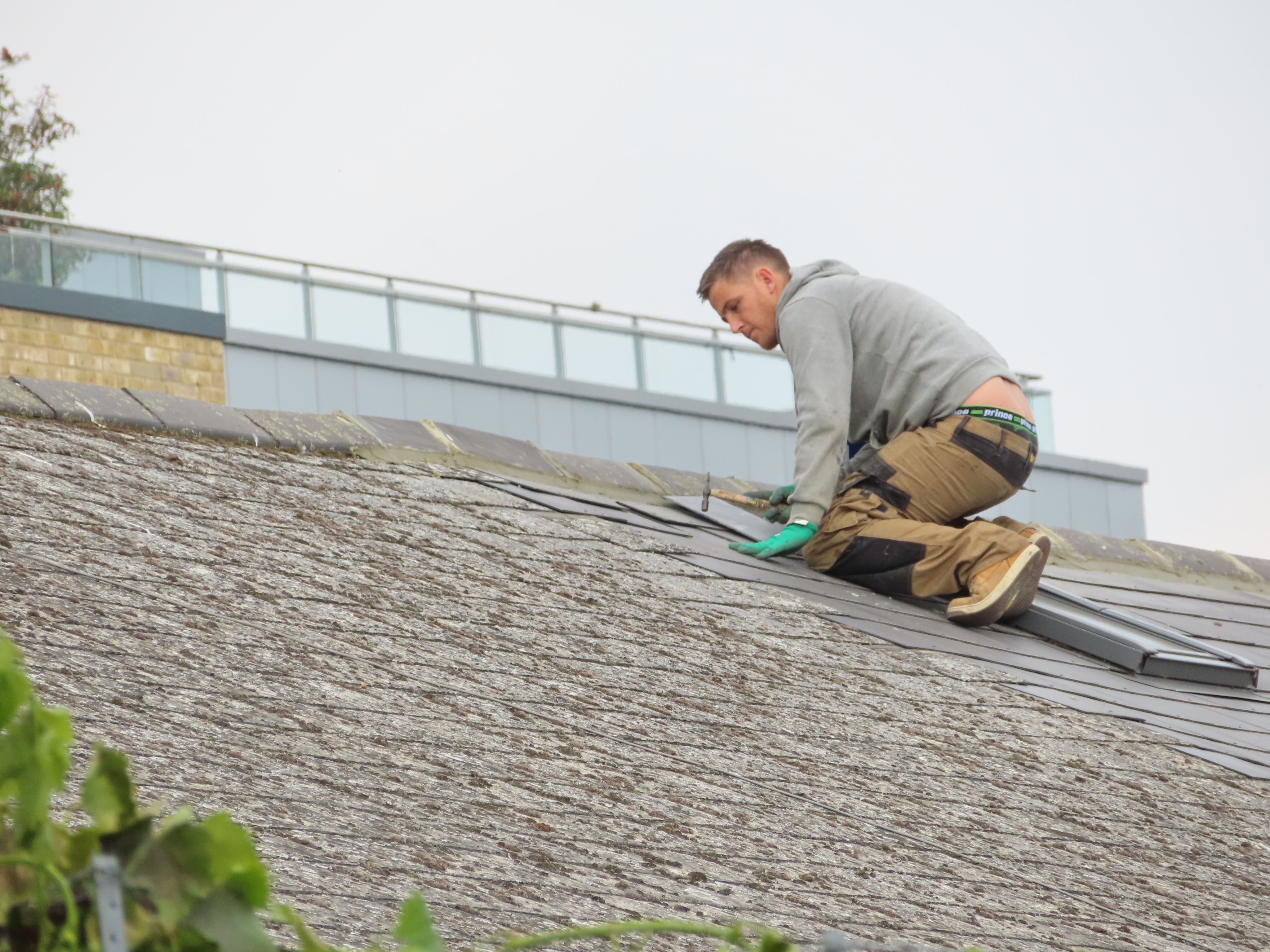 Professional roof repair work in progress